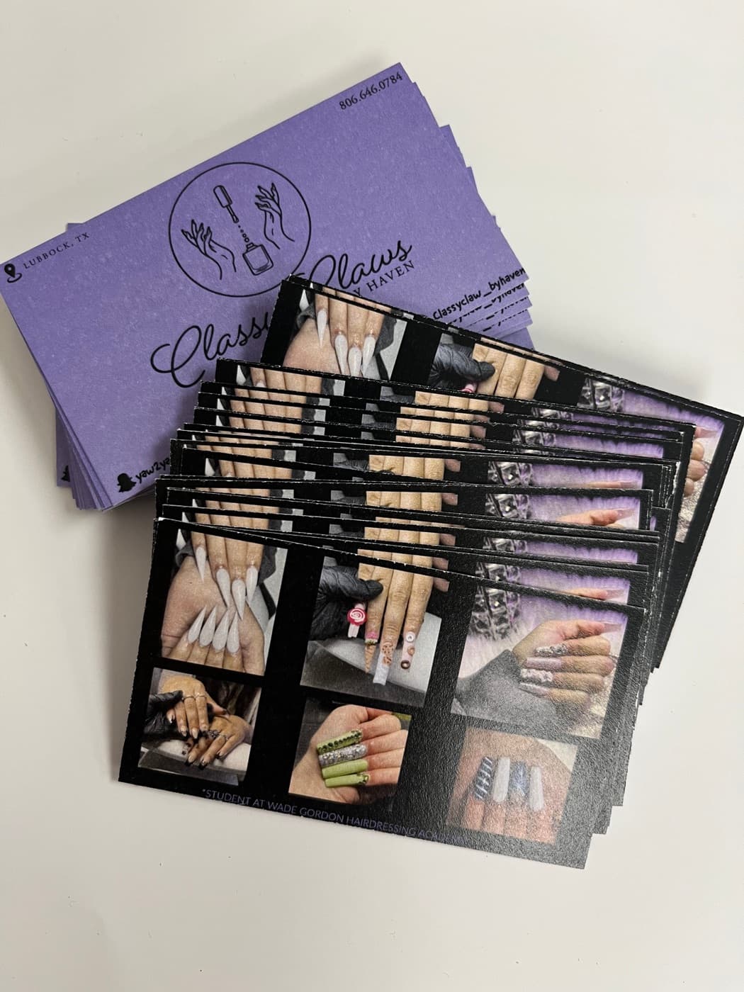 Purple business cards and full-color cards for a nail salon