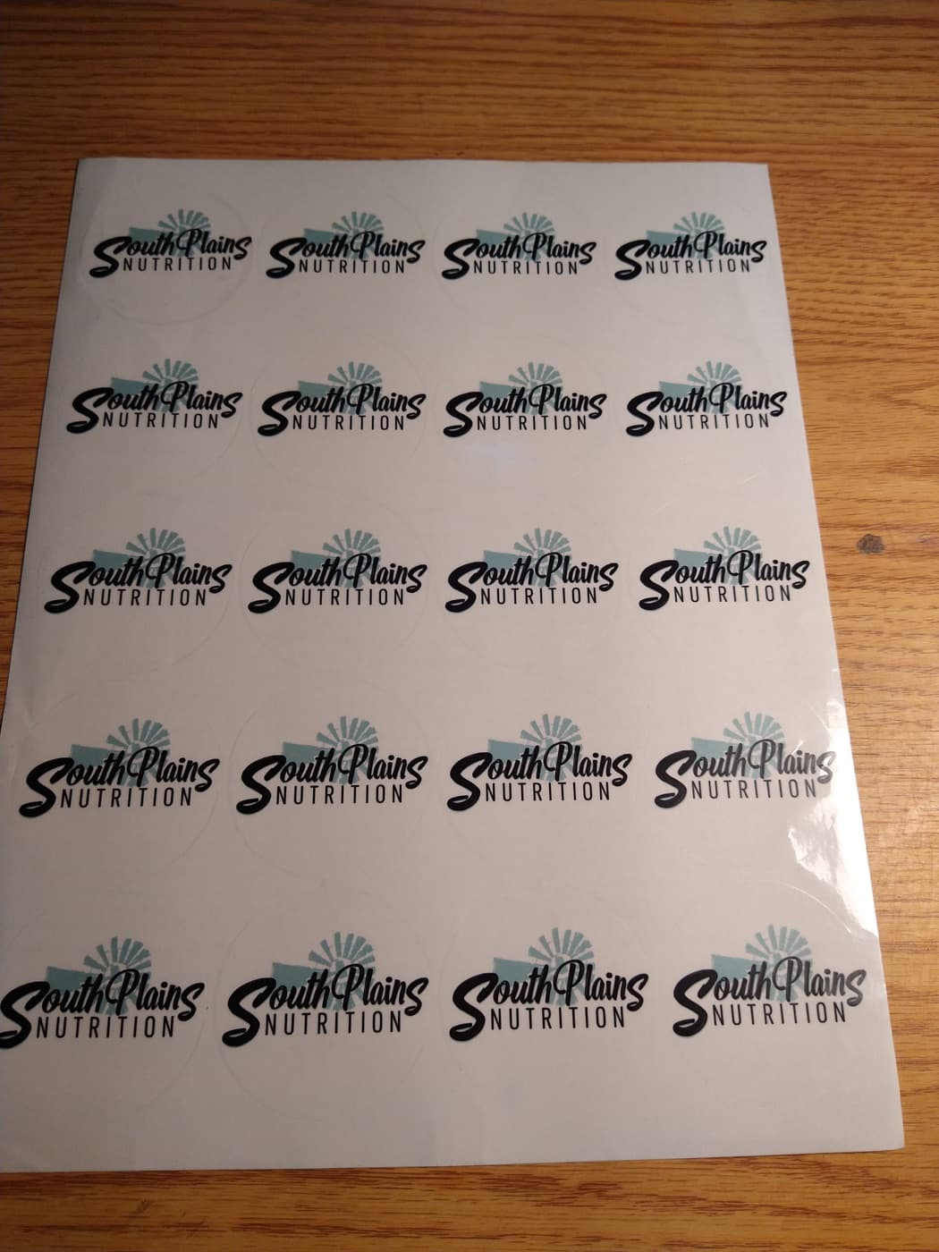A sheet of round logo stickers